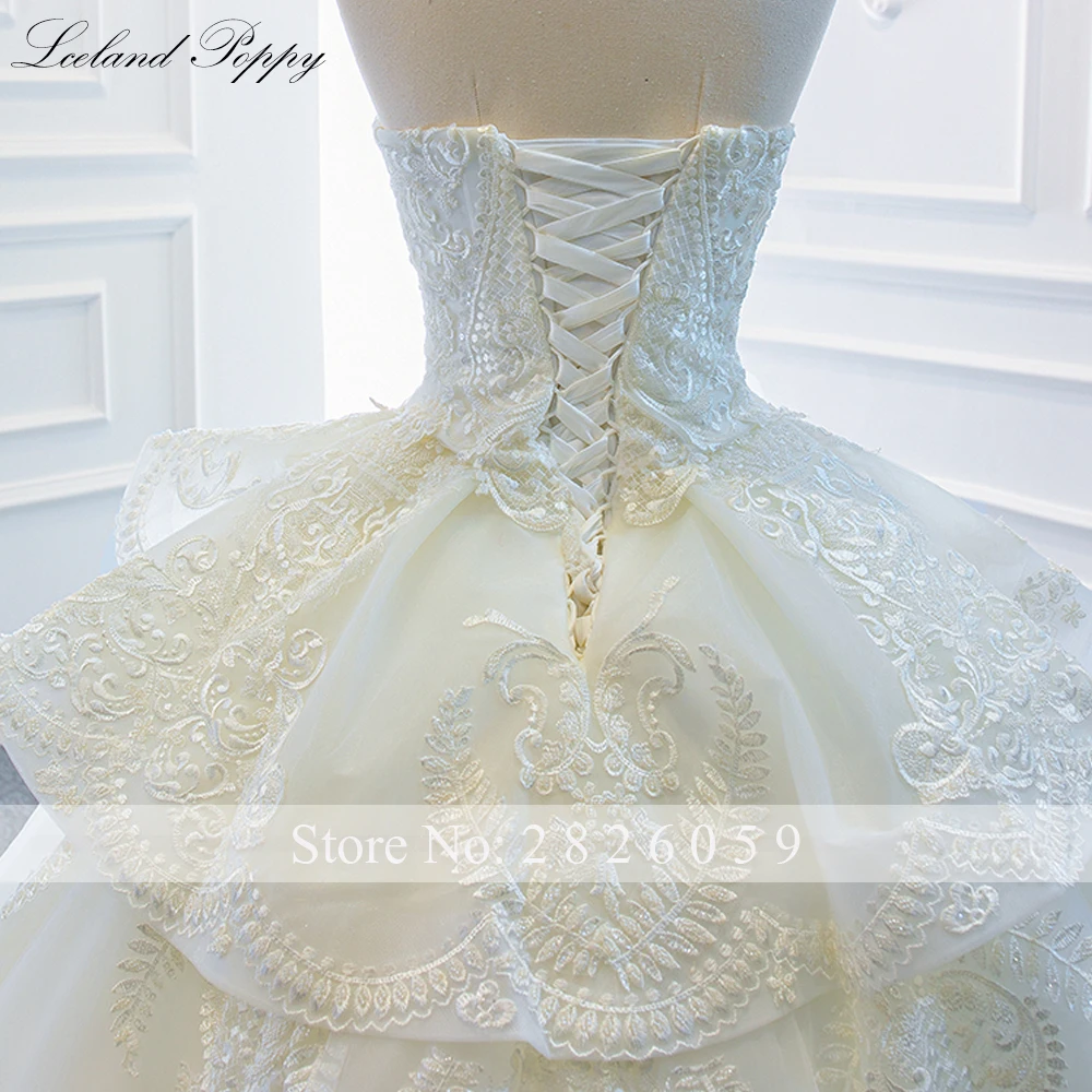 IJsland Poppy op maat gemaakte strapless baljurk kanten trouwjurken mouwloze kralen vloerlengte gelaagde bruidsjurken