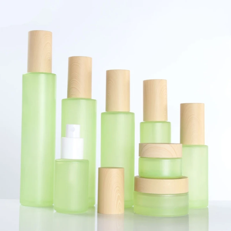 

500Pcs 20g 50g 20ml 30ml 40ml 50ml 60ml 80ml 100ml 120ml green Frost Glass Cream Jar with Wooden line Cap Lotion Spray bottle