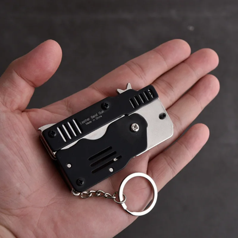 New Mini Folding Can Hold The Key Chain of The Rubber Band Gun Six Bursts Made  Shooting Toy Gifts Boys Outdoor Tools