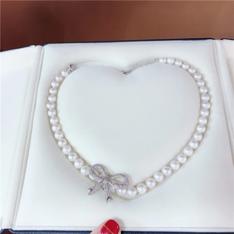 

Hot sell new style 43cm 8-9mm white freshwater pearl necklace zircon bowknot accessories sweater chain fashion jewelry