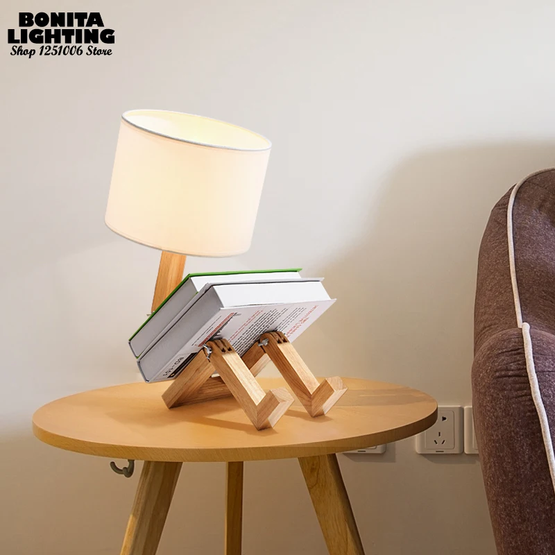 Humanoid bedside desk lamp Nordic simplicity table light Joint folding naughty little man Reading table lamp