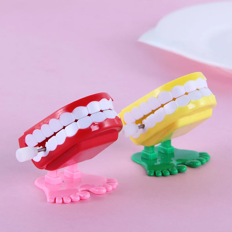 1Pcs Nostalgic Classic Children Clockwork Toy Funny Style Modeling Jumping Denture Wind Up Toys