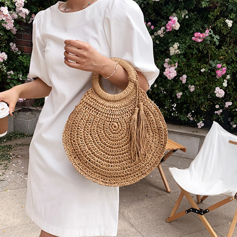 Borse di paglia rotonde da donna estive borsa a tracolla in Rattan borsa da spiaggia intrecciata a mano borse da donna di Design con nappe di grande