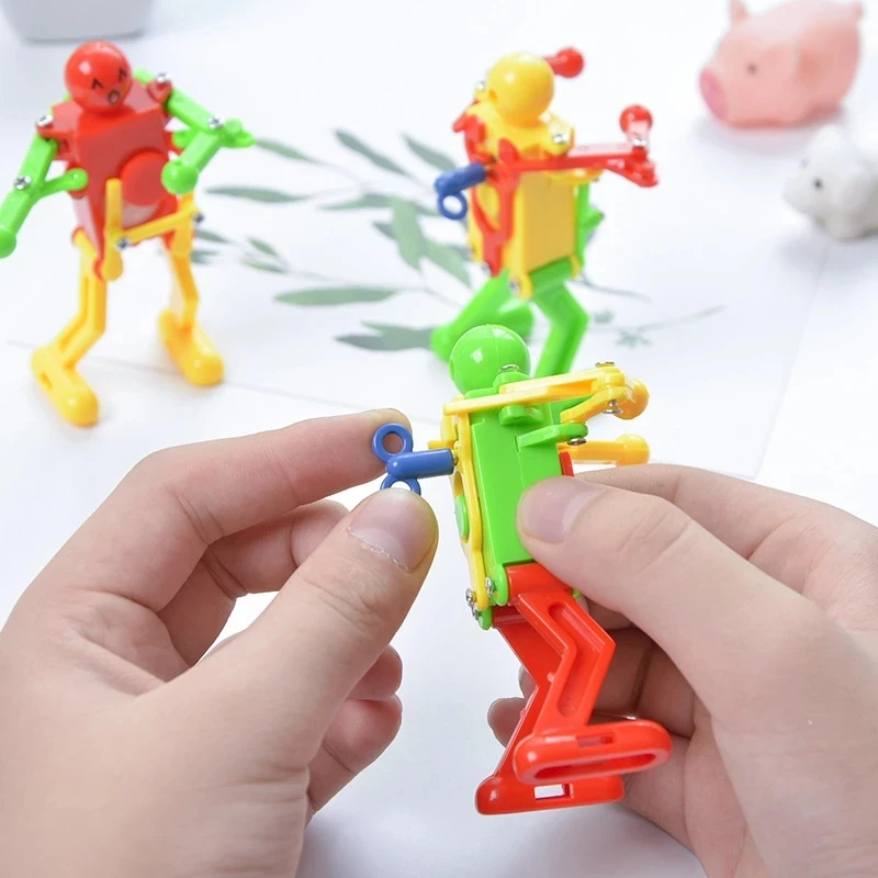 1Pc Random Funny Kids Toys Spring Clockwork Toy Mini Dance Robot Wind Up Toys For Children Boys Educational Toys