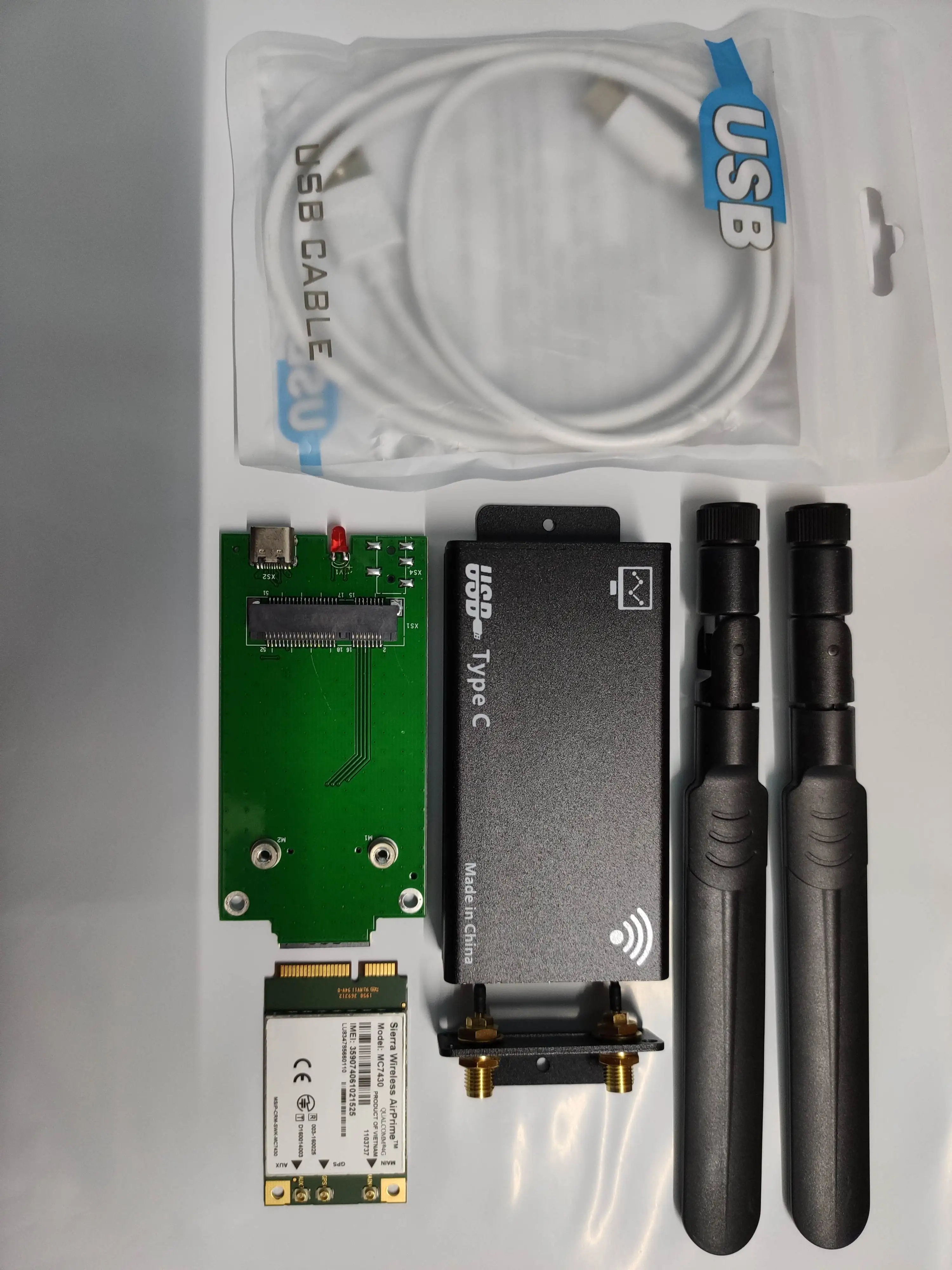 

MC7430 Sierra Wireless mini pcie module + black case+LTE antenna+pigtail+USB cable+PCB