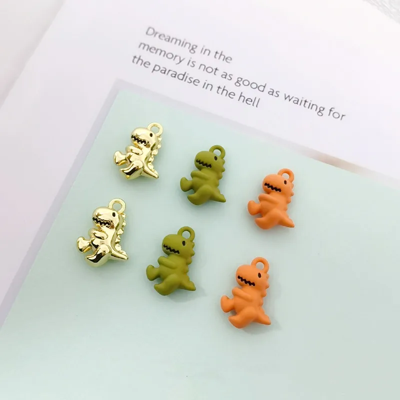 Colgante de Metal con forma de dinosaurio en 3D, pendientes de Color dorado, accesorios de joyería, 17x12x5mm, 10 unids/pack