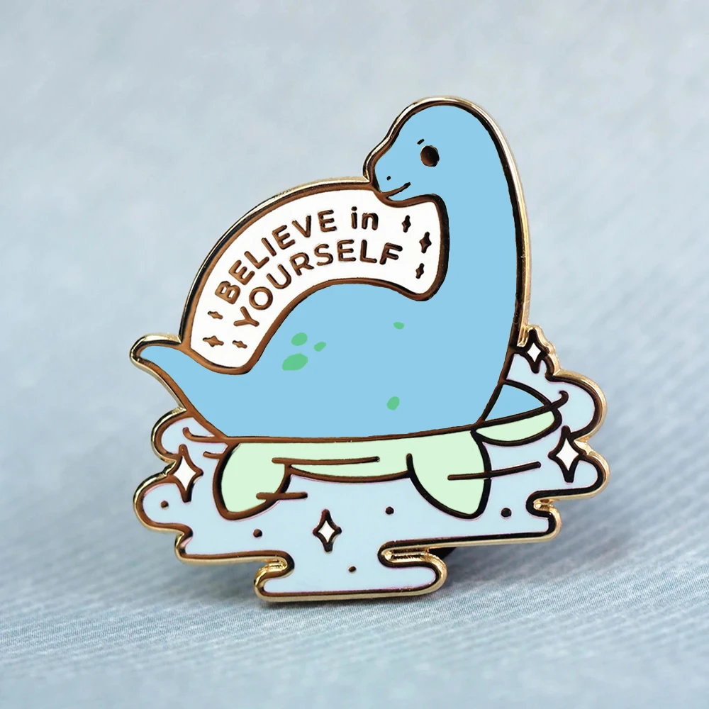 

Believe In Yourself Funny Loch Ness Monster Hard Enamel Pin Cute Cartoon Dinosaur Swim Medal Brooch Fashion Lapel Backpack Pin