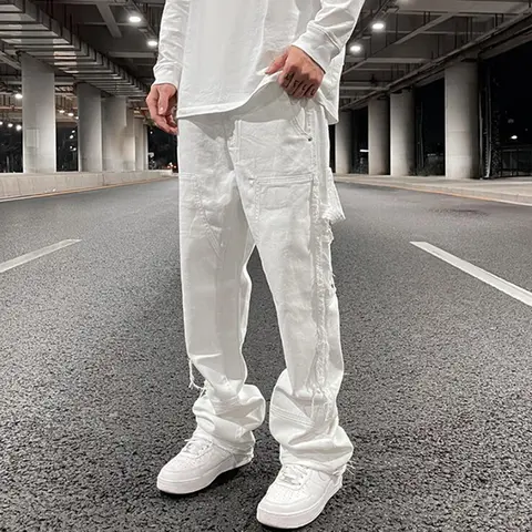 Hip Hop beyaz düz yırtık rahat erkek kot pantolon hem yan püskül geniş bacak Streetwear Denim pantolon boy