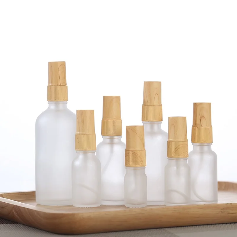 

15pcs Mist Spray Bottle 5ml10ml15ml20ml30ml50ml100ml Pump False Wood Lid Oil Liquid Container Frosted Glass Refillable Bottles