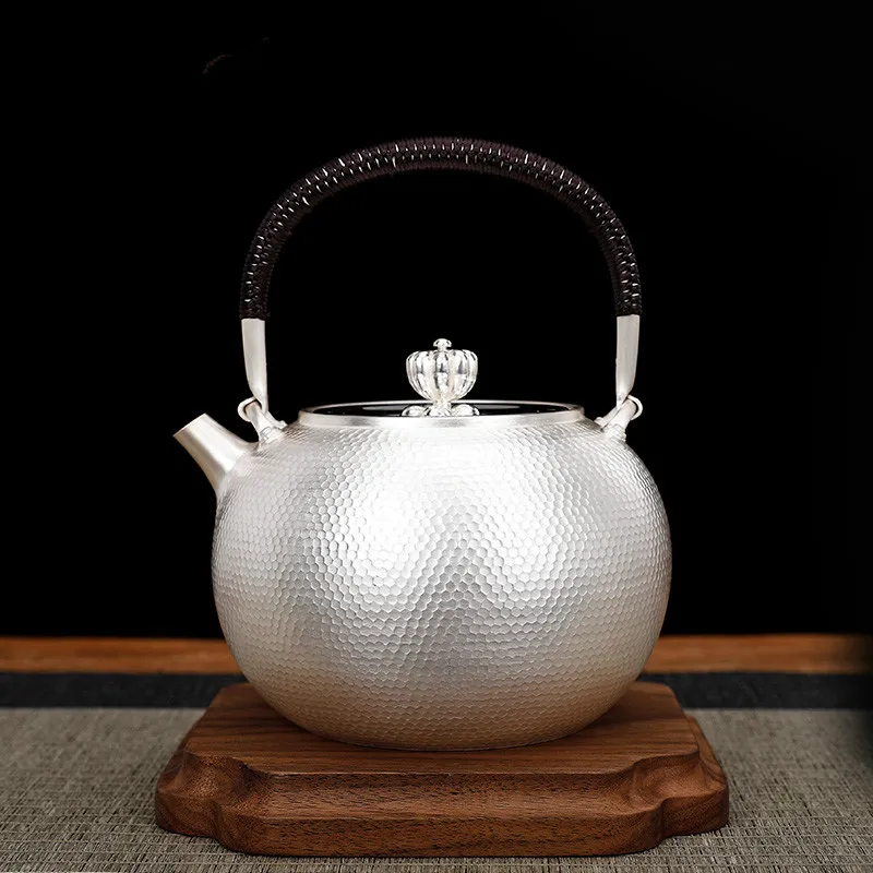 

Seiko Japanese-style silver tea set, a sterling silver 999 kettle, home tea ceremony