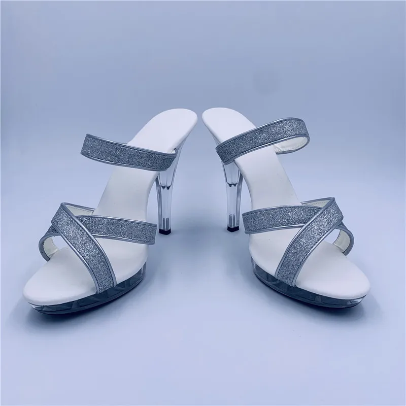 Models walk the stage in sexy silver sequined heels and nightclub chic 13cm high-heeled sandals