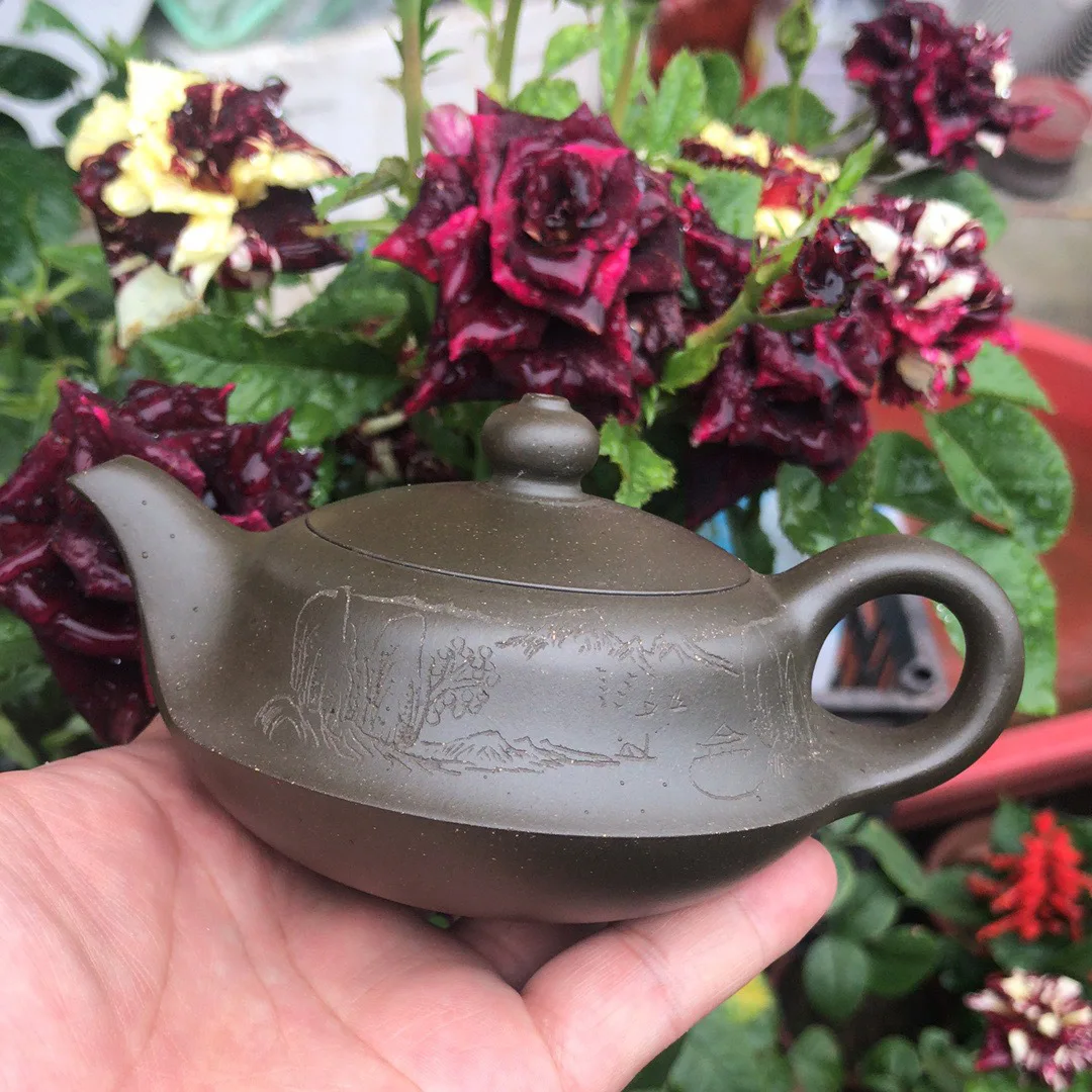 

Yixing purple clay teapot Tang Junquan hand painted green clay curved teapot