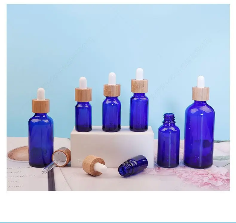 

20pcs 5ml 10ml 15ml 30ml 50ml blue essential oil glass dropper bottle with bamboo lid bamboo serum bottle e-liquid