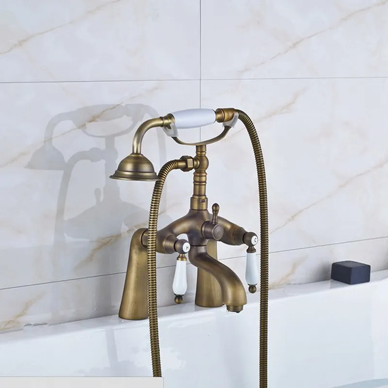 

Antique Brass Deck Mounted Bathroom Tub Faucet Dual Ceramics Handles Telephone Style Hand Shower Clawfoot Tub Filler aan008