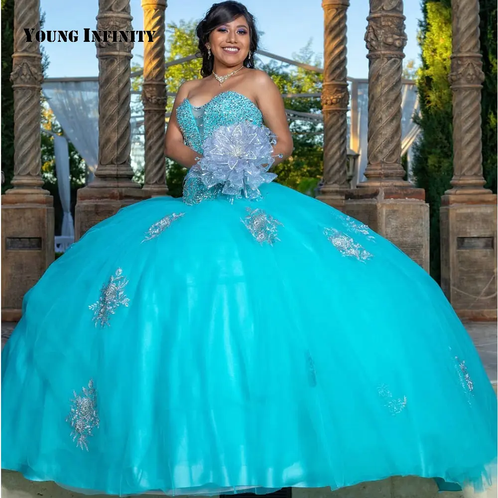 Charming Blau Bodenlangen Quinceanera Kleider Tüll Schatz Backless Perlen Appliques Pailletten Kapelle Zug Ballkleid 2021