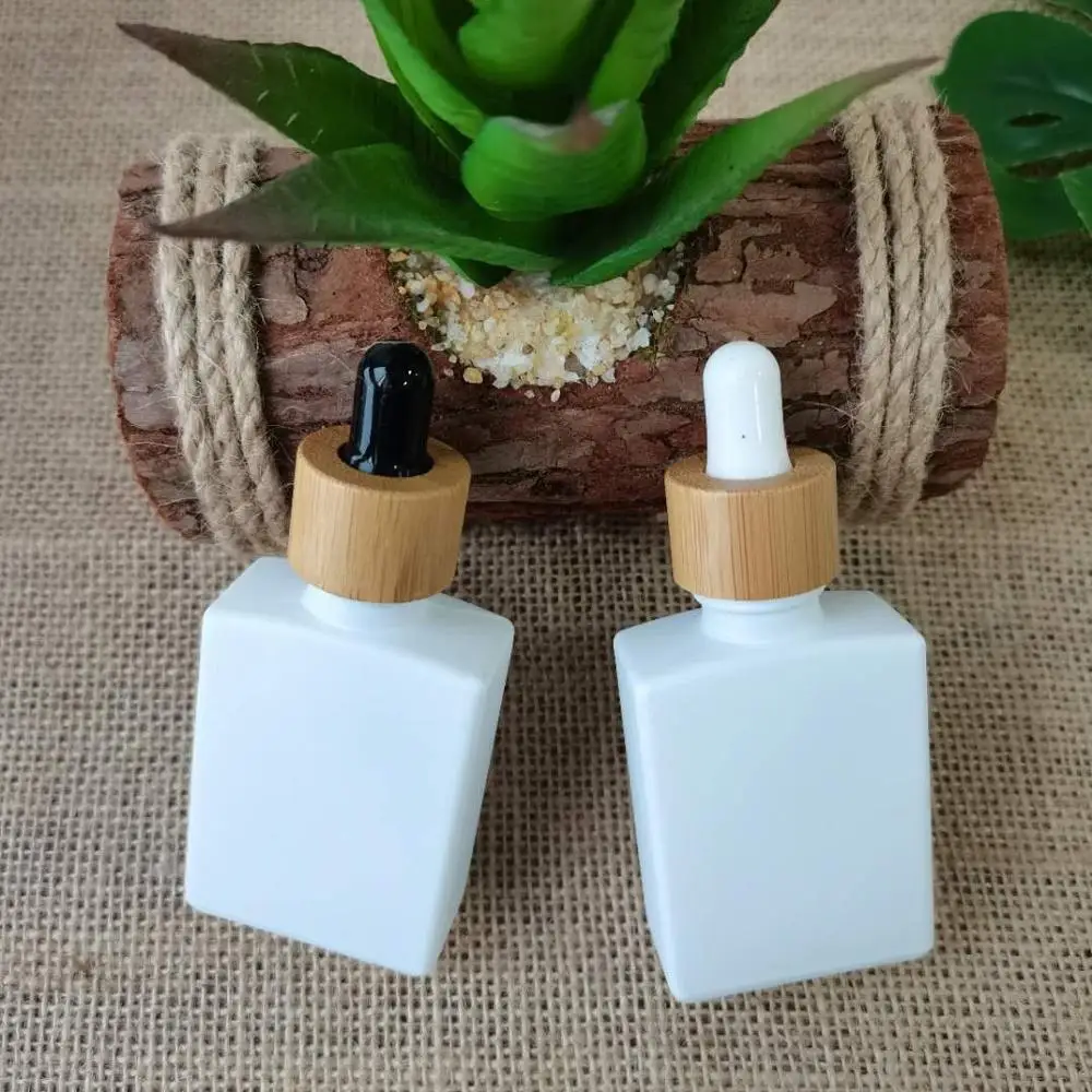 

Bamboo dropper bottle wholesale 30ml matte frosted white dropper bottles with bamboo white/black rubber lid