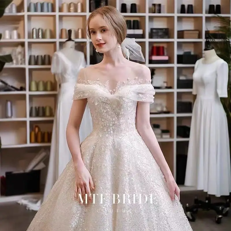 Luxury Shiny Wedding Dresses Appliques Beaded Boat Neck Lace Up European Scoop Neck Trailing Starry Sky Bling Bride Gowns New