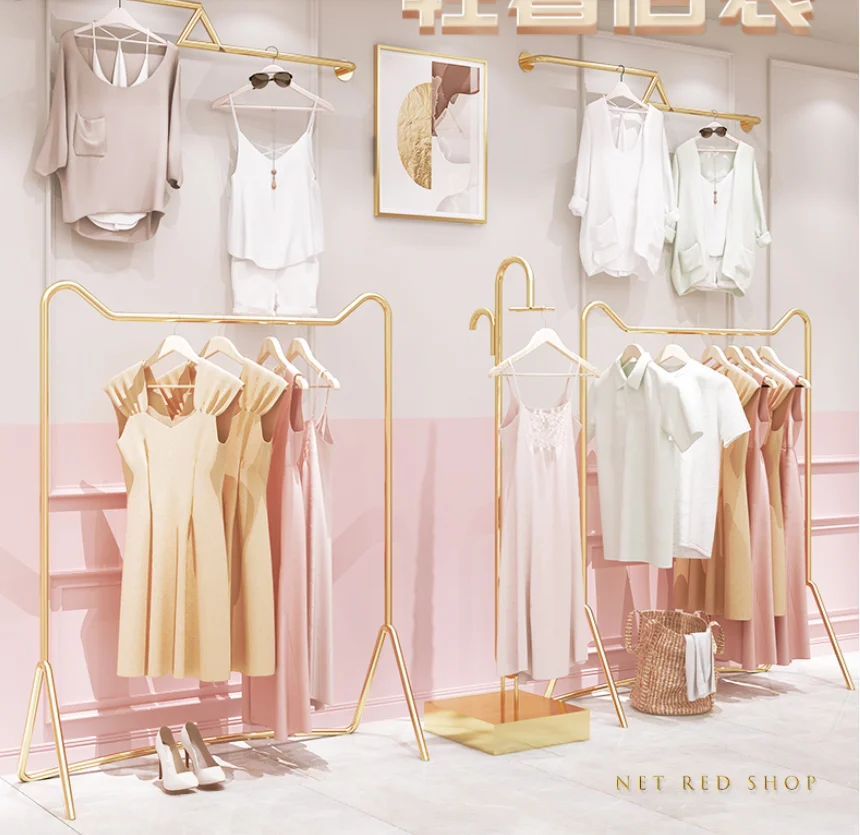 

Clothing store display racks, floor-standing hangers, clothes rails, wall display shelves, gold