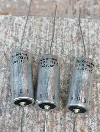 1pcs/1lot Axial electrolytic capacitor    axial 0.1UF 0.1+0.003*2 250VAC vacuum cleaner motor capacitor double outlet