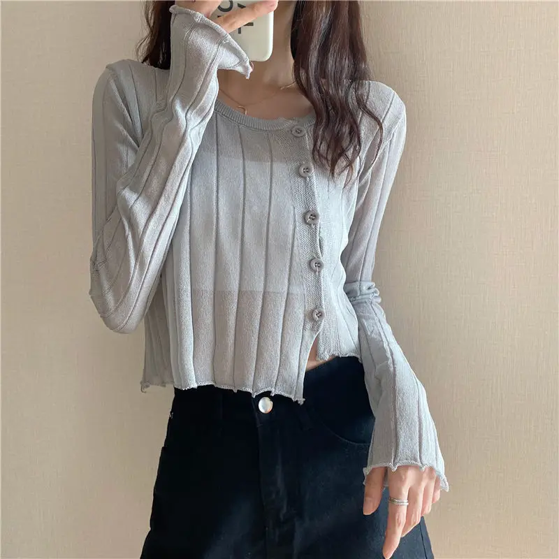 Women's Korean irregular long-sleeved cardigan outside with thin solid spring and summer short ice wire knitted cardigan top