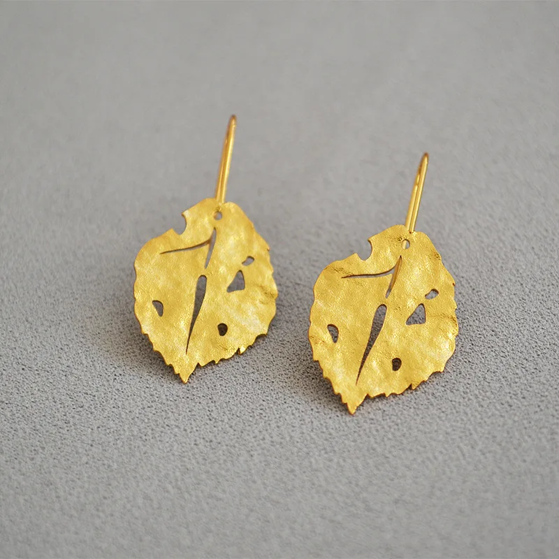 

WT-E642 European and American fashion nubuck grain feel Retro Gold Leaf personality cold temperament casual earrings woman