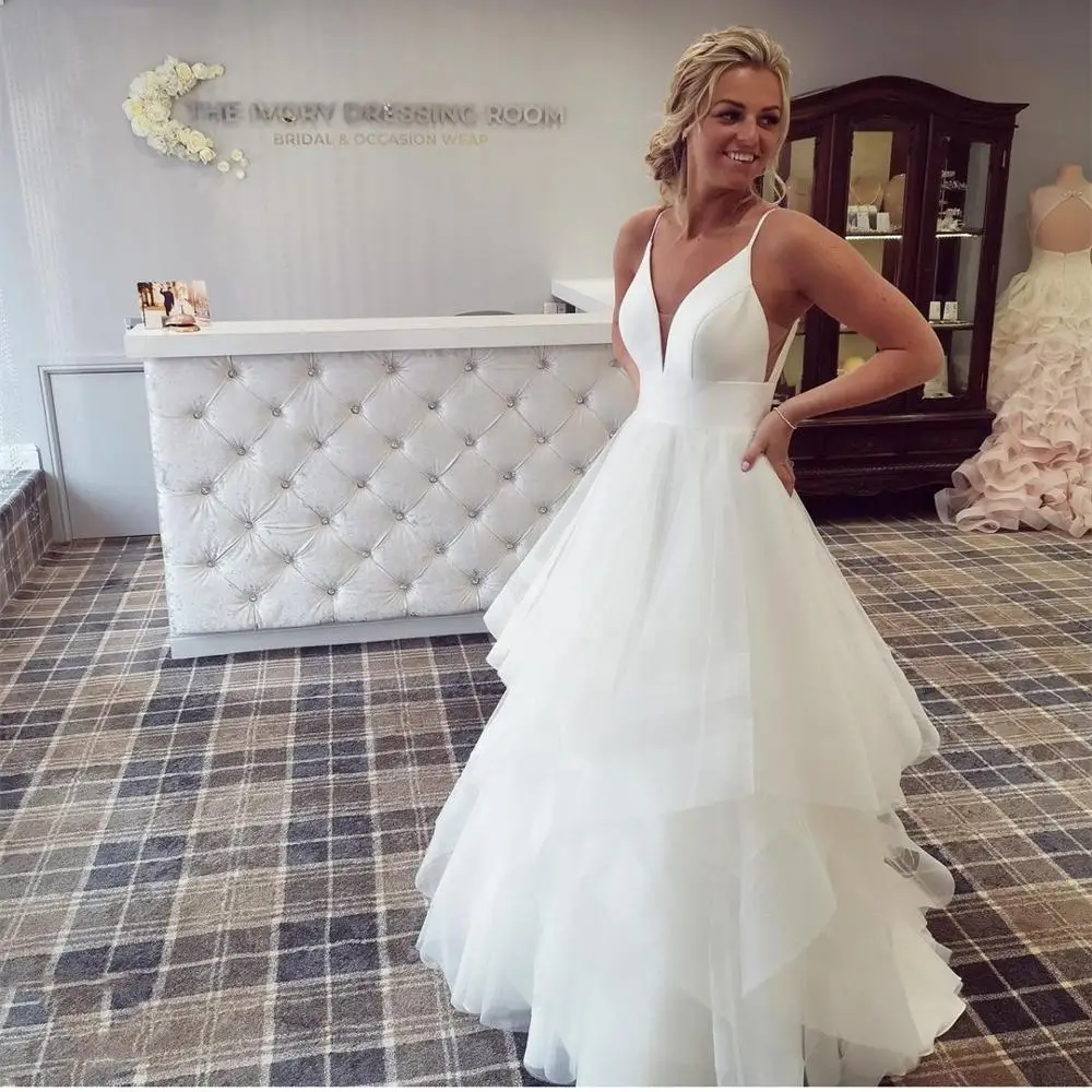 Abito da sposa a trapezio cinturino per Spaghetti Tulle Organza torta lunghezza del pavimento Robe De Mariee senza maniche su misura schiena bassa principessa