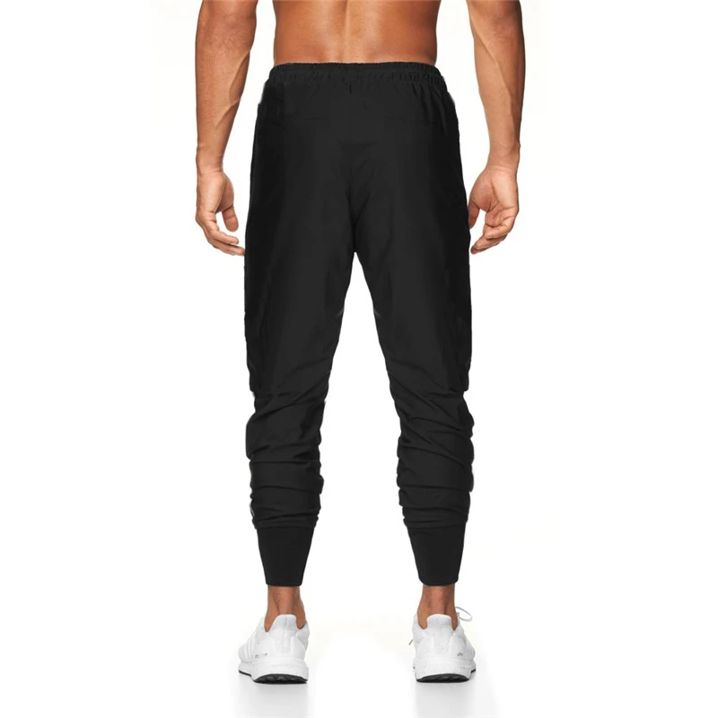 Joggers pantalones casuales de los hombres pantalones ajustados haz boca Pantalones Hombre Pantalones de gimnasio de entrenamiento de Fitness culturismo Pantalón deportivo