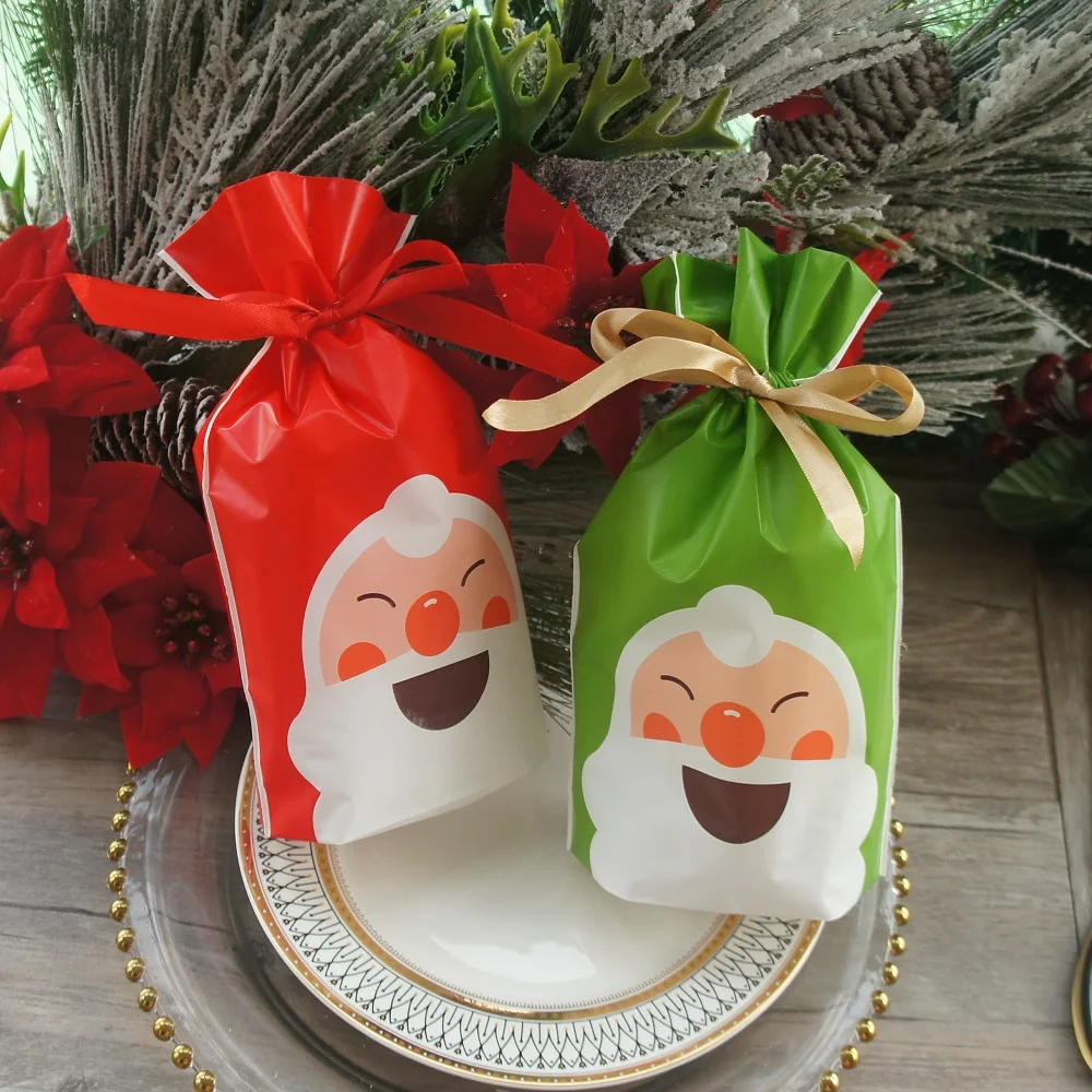 

23*15cm 50pcs Red Green Christmas Smiling Santa Design Bag Cookie Candy Handmade Party Favors Gift Plastic Packaging Bags