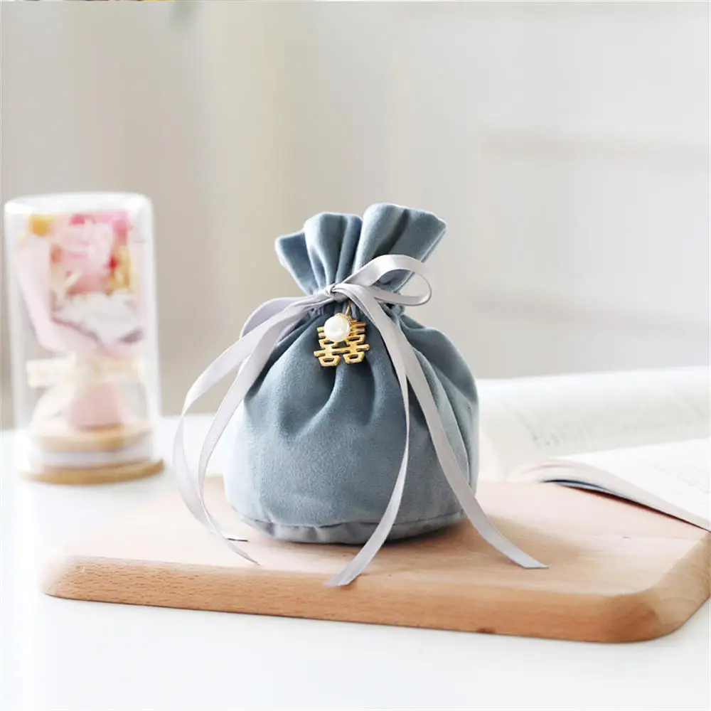 Sacchetto regalo bustina di velluto con coulisse di imballaggio di lusso per gioielli scatole di caramelle per matrimoni con decorazioni di perle