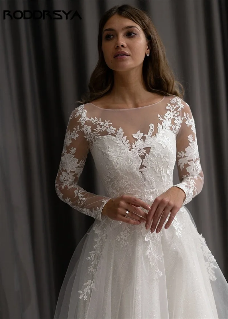 RODRSYA Una linea Pizzo Appliques Manica Lunga Glitter Abito da Sposa Paillettes IllusionRODDRSYA A line Lace Appliques manica lunga Glitter abito da sposa paillettes Illusion Back Beach abiti da sposa vestido de noiva