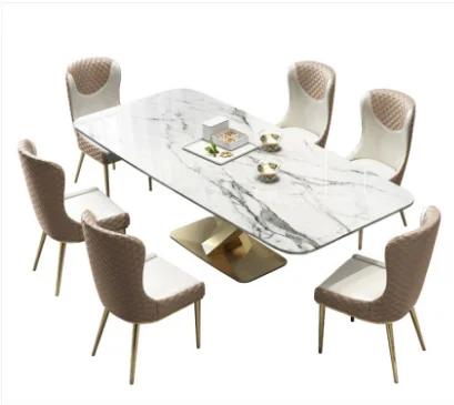 

Nordic marble light luxury dining table and chair combination post modern simple Italian dining table stainless steel rectangula