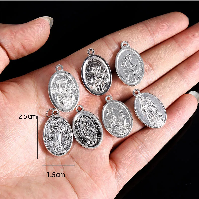 A variety of religious Christ small pendants, Lourdes small pendants, Saint Francis small pendants, Saint Michael small pendants