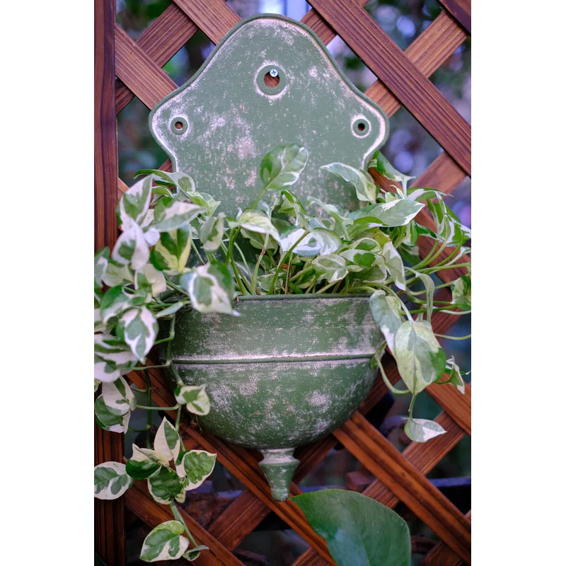 

green retro vintage metal wall mounted flower pot