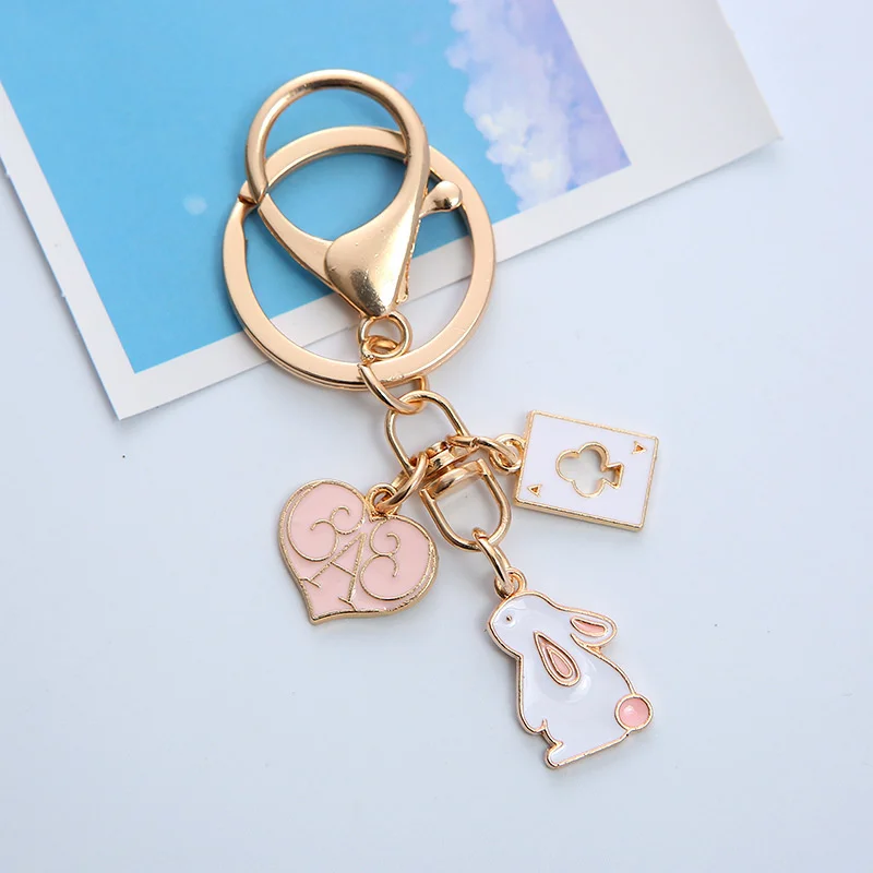 Porte-clés en métal mignon de dessin animé lapin rose pêche fraise sac de voiture porte-clés fille garçon Couple bijoux lanière casque pendentif