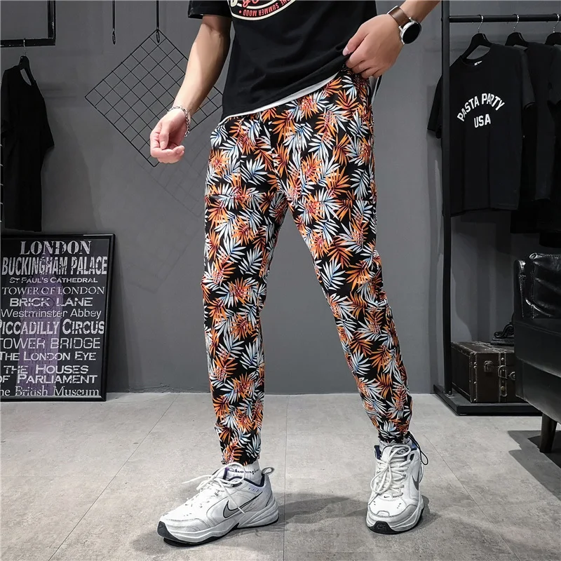 Pantaloni a vita bassa Streetwear Harajuku pantaloni sportivi stile cinese pantaloni Jogger estivi uomo Cargo Harem pantaloni Hip-Hop moda Casual fiore