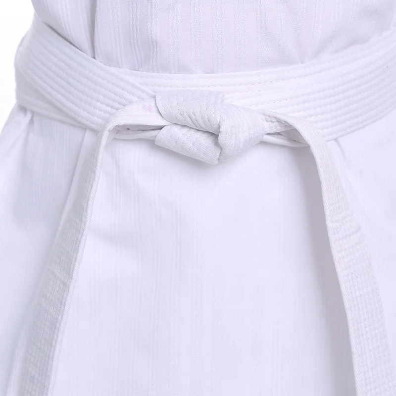 Nuovi costumi TKD abbigliamento bianco Taekwondo uniformi WTF Karate Judo Dobok vestiti bambini adulto Unisex manica lunga Gi uniforme