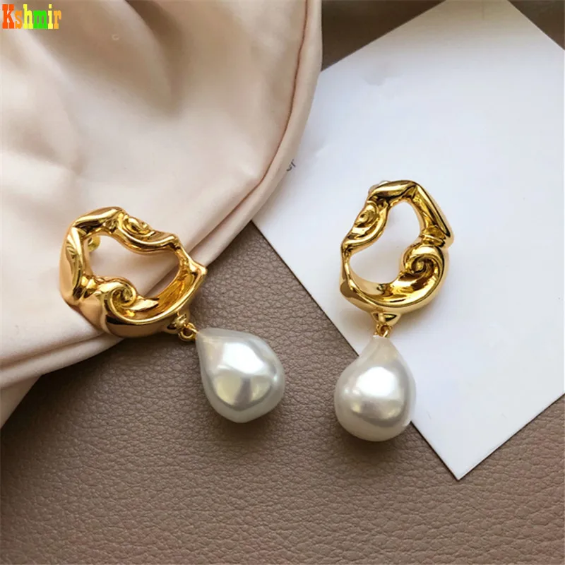 

Kshmir irregular metal hanging Baroque abnormity pearl Korean female earrings Lava pearl High imitation pearl female earrings