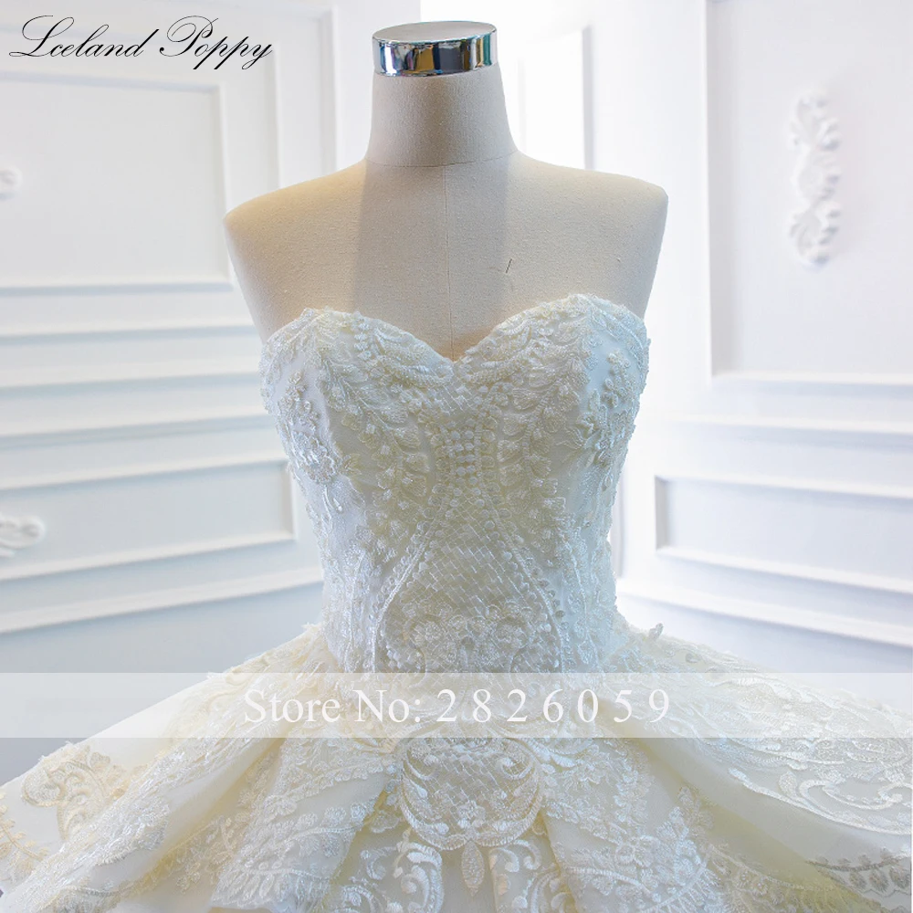 IJsland Poppy op maat gemaakte strapless baljurk kanten trouwjurken mouwloze kralen vloerlengte gelaagde bruidsjurken