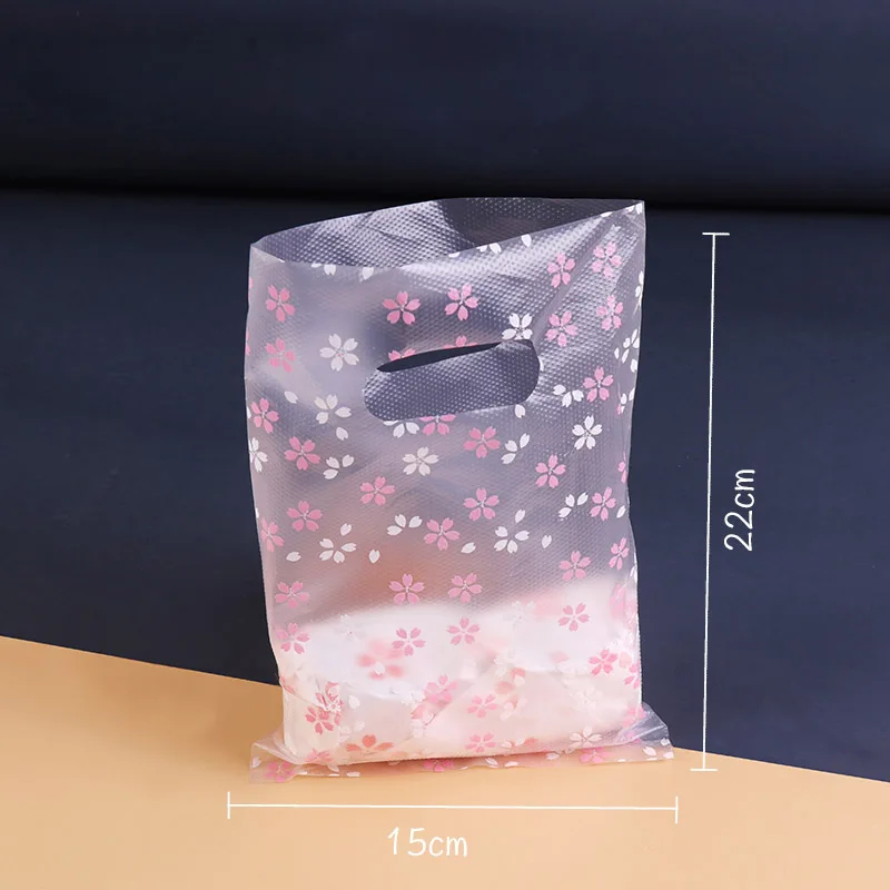 500pcs Cherry Blossom Shopping Bag Sakura Flower Plastic Gift Bag with Handle for Snack Candy Cookies Wrappers