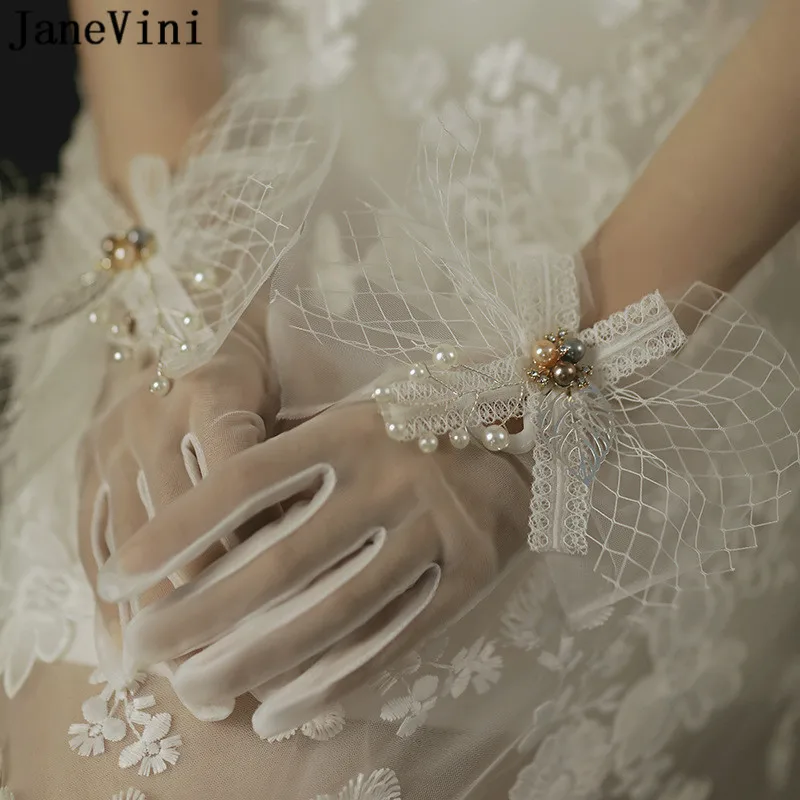 JaneVini-guantes de boda con perlas hermosas para mujer, manoplas de encaje blanco para novia, accesorios de fotografía para fiesta de boda con lazo