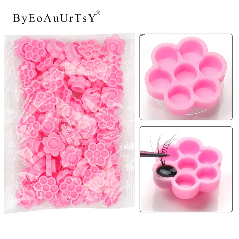 100 個まつげ接着剤ホルダーカップラッシュリフティング接着剤収納ツールまつげエクステンションブロッサム遅延容器メイクアップアクセサリー