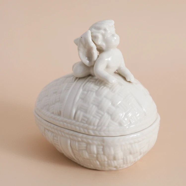 

Cream-colored Braided Egg Relievo Angel Receiving Jar Ceramic Jewelry Box