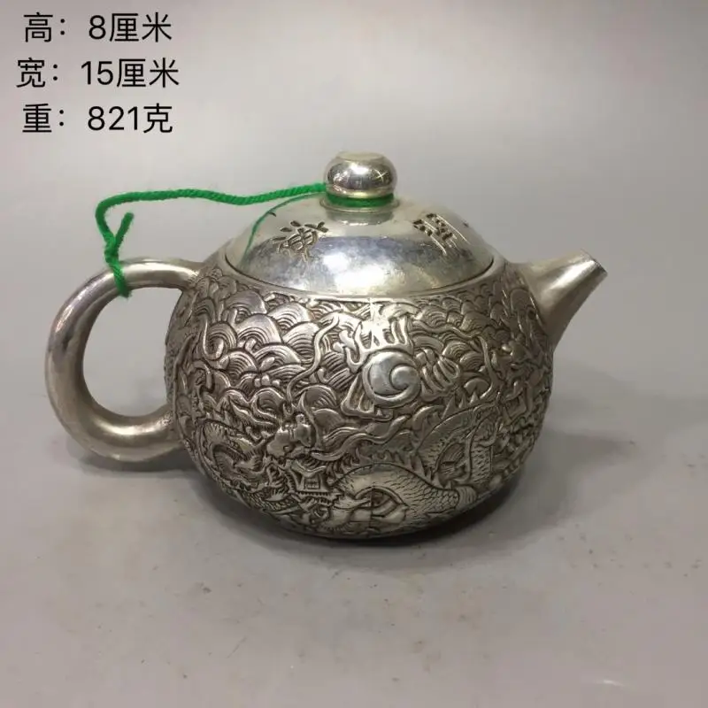 

Qianlong dynasty White copper Retro Relief Five dragons make trouble in the sea water Tea Pot Cupronickel carving teapot