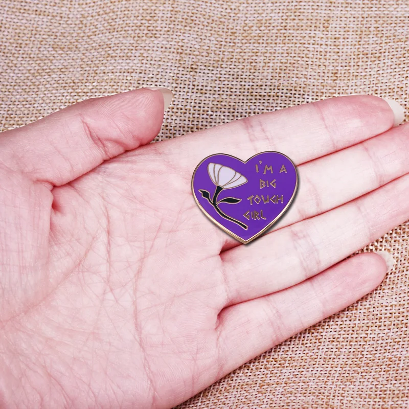 Megara heart shaped pin with a classic quote from Hercules