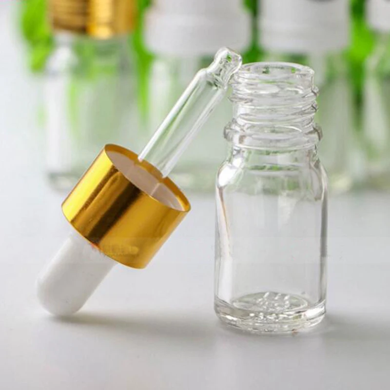 

Wholesale Empty Glass Clear Dropper Bottle 5ml Glass E liquid Bottle With Gold Childproof Cap And Pipette For Sale