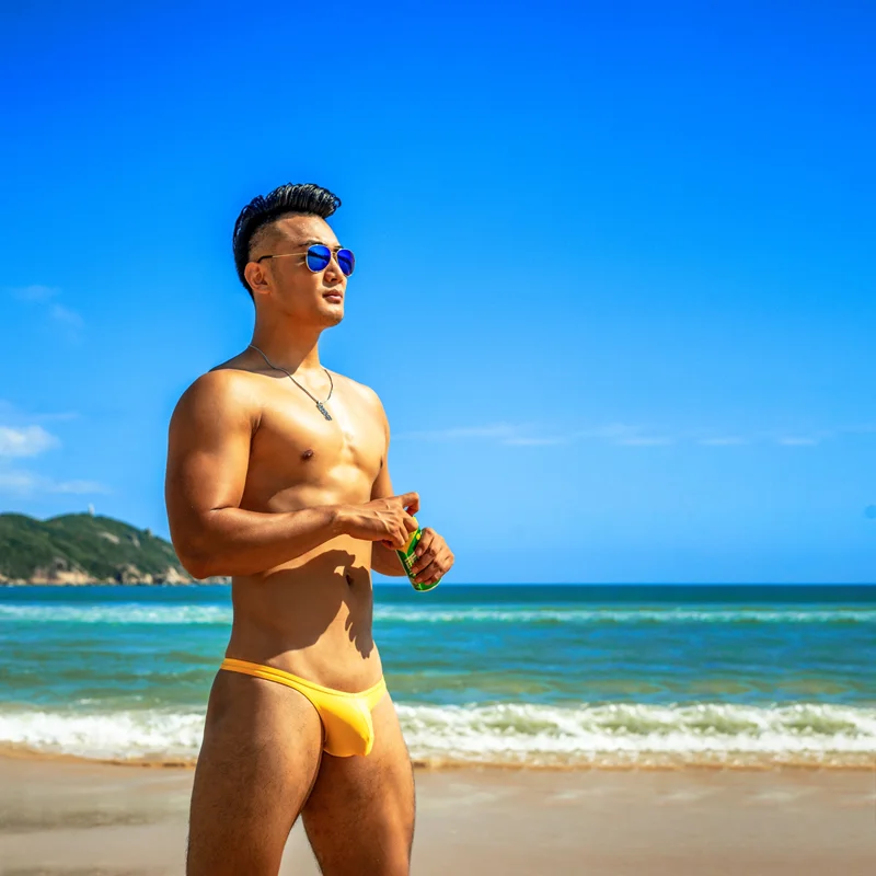 Sexy bright yellow men swimwear bikinis hot pouch gay men swim trunks briefs man tight ultra low waist half pack hip swimsuits