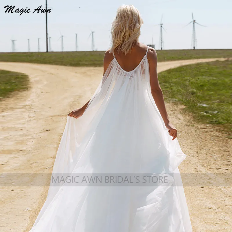 Magic Awn 2022 Boho Wedding Dresses Spaghetti Straps Beaded Shiny White Tulle Illusion Boho Mariage Gowns With Wrap Vestidos