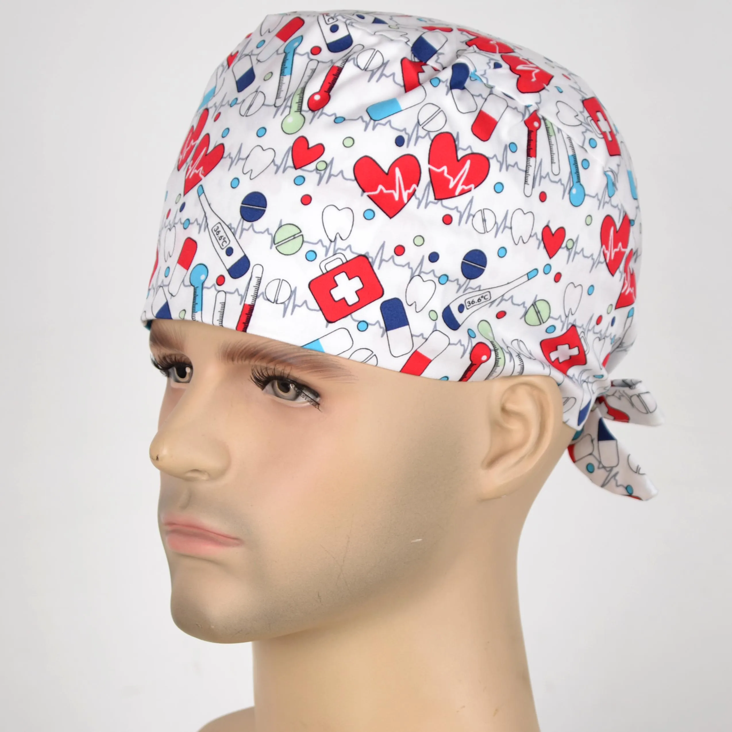 

Hennar unisex scrub hats in white with hearts and ribbons in 2 sizes for different head