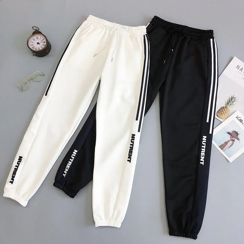 Pantalones de chándal holgados para Mujer, ropa de calle informal, pantalones Harem holgados negros, pantalones de tela suave Harajuku para Mujer