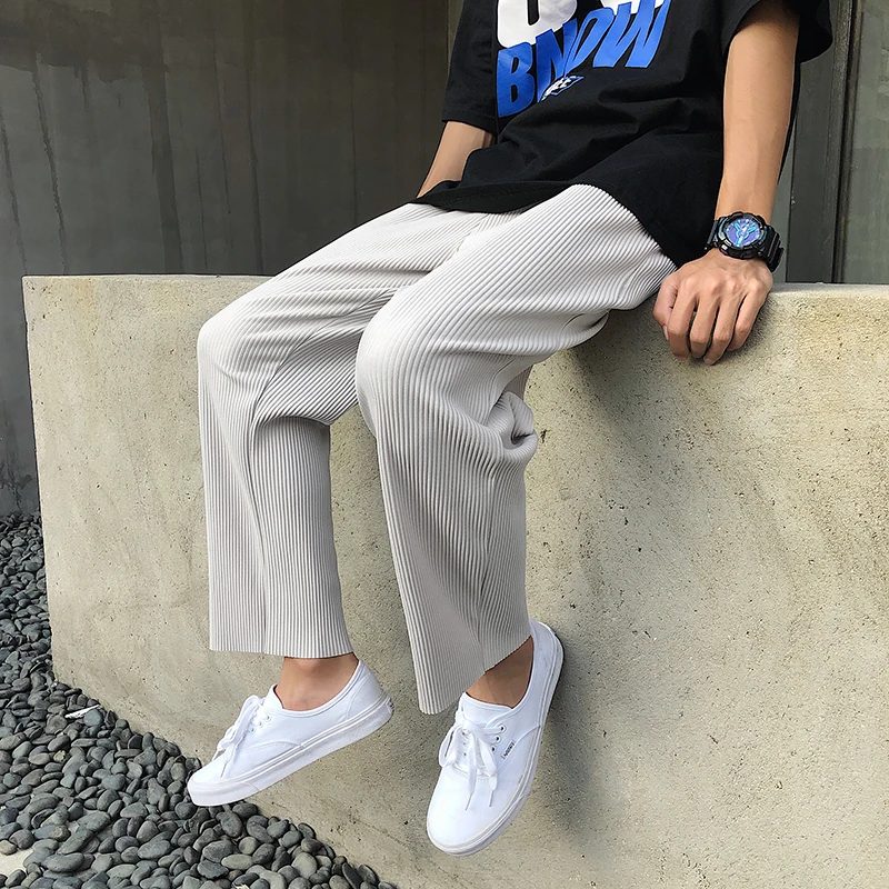 Koreańska wersja plisowane proste spodnie męskie nowa moda elastyczna talia Casual spodnie męskie Streetwear lodowy jedwab spodnie męskie spodnie